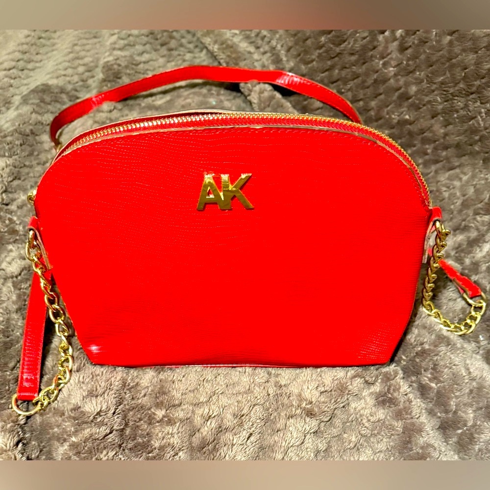 Vibrant Red and Gold Crossbody Bag with Chain Detail
